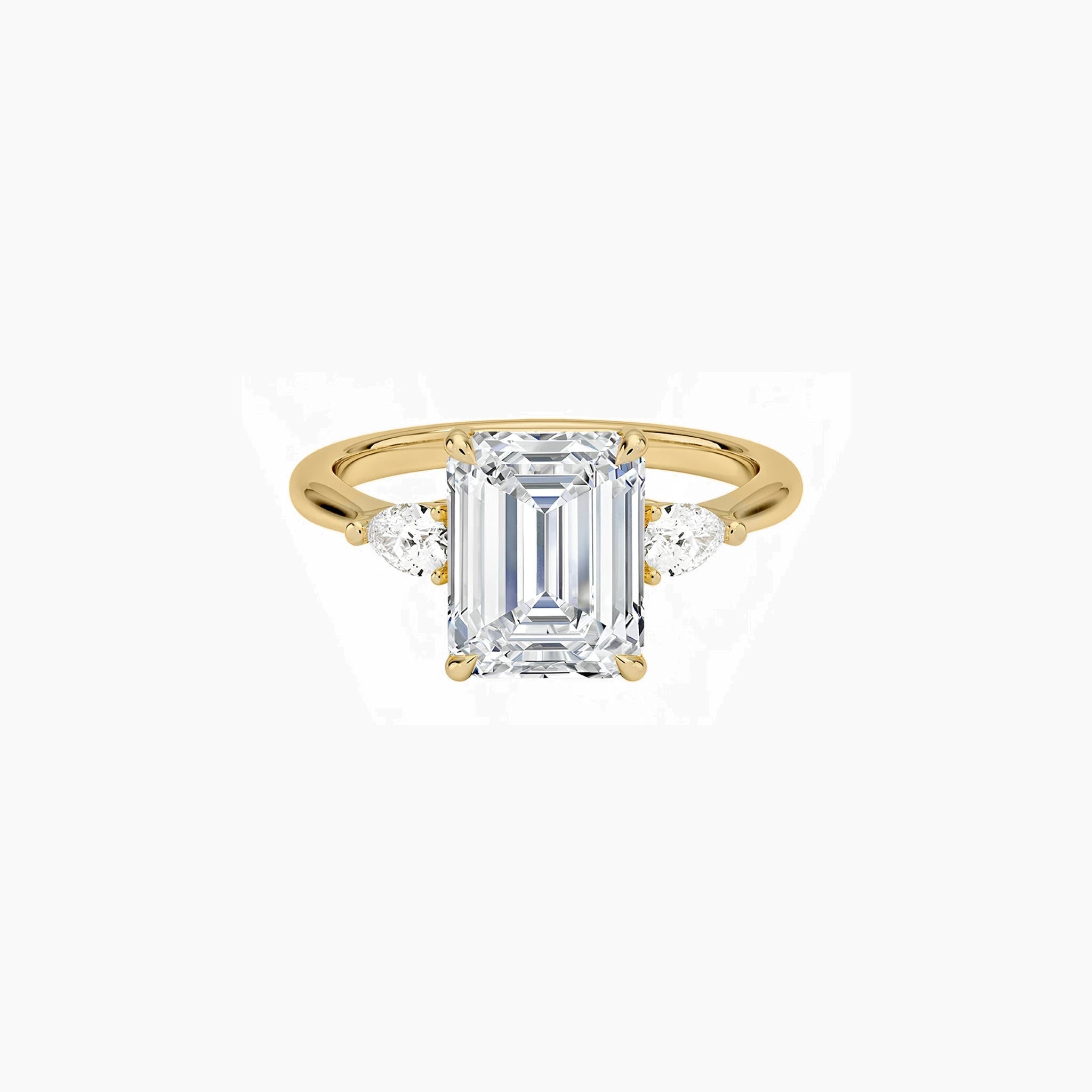 Emerald-cut moissanite three-stone ring in yellow gold vermeil, front view.