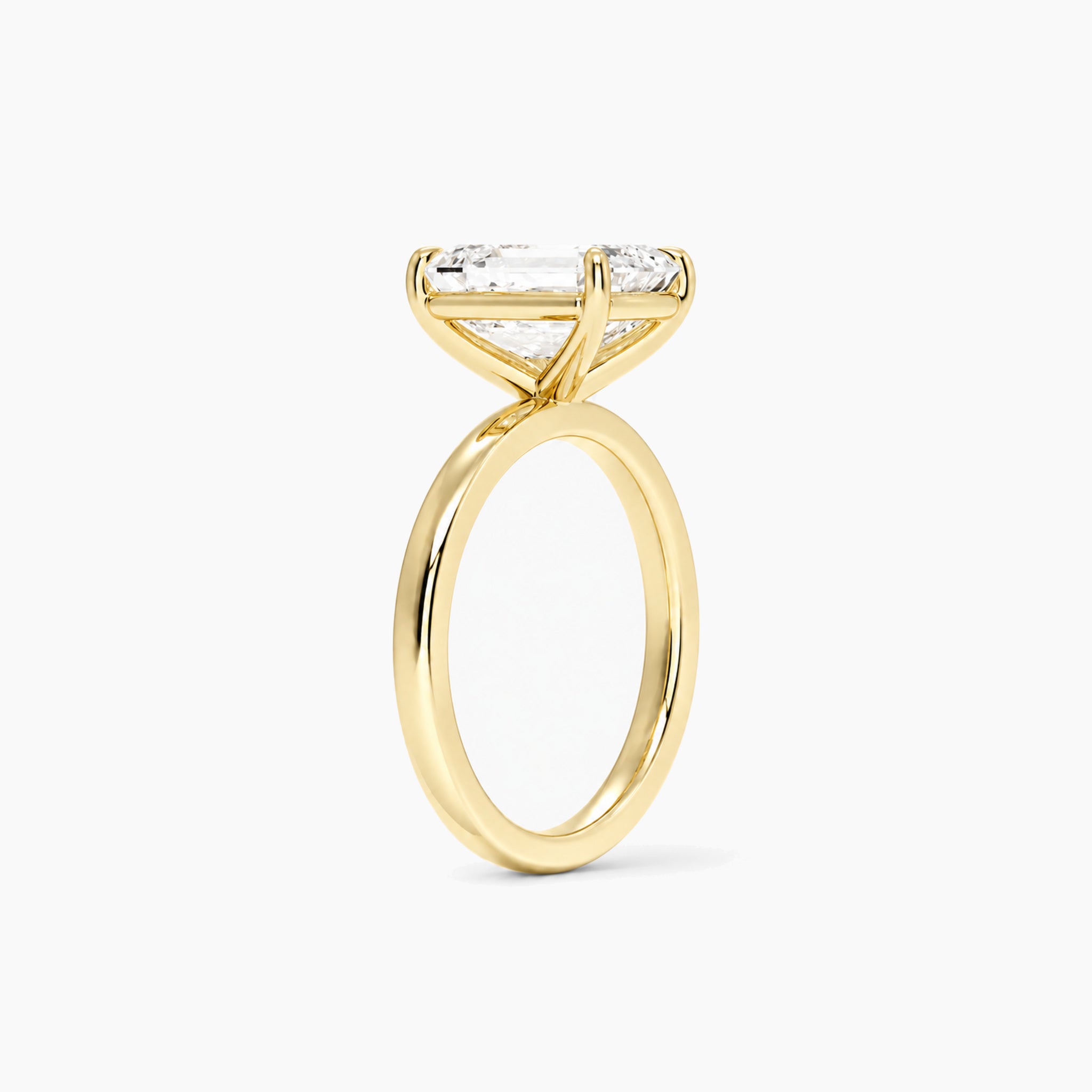 emerald-cut moissanite solitaire ring in yellow gold vermeil, side view