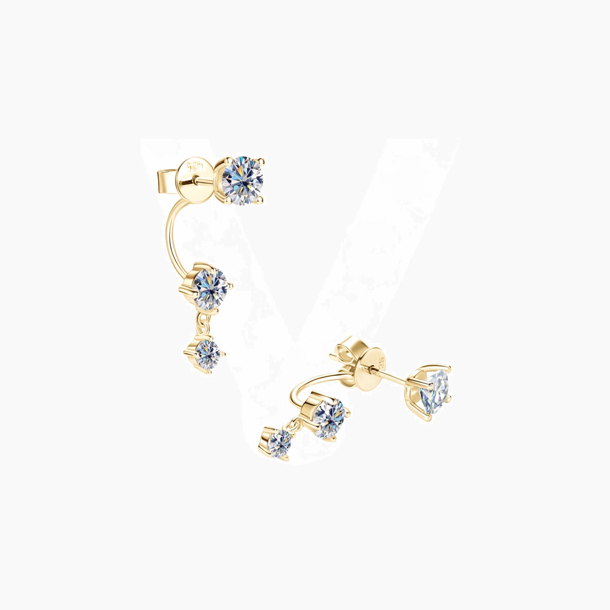 Floating three-stone moissanite drop earrings in yellow gold vermeil, angled view.