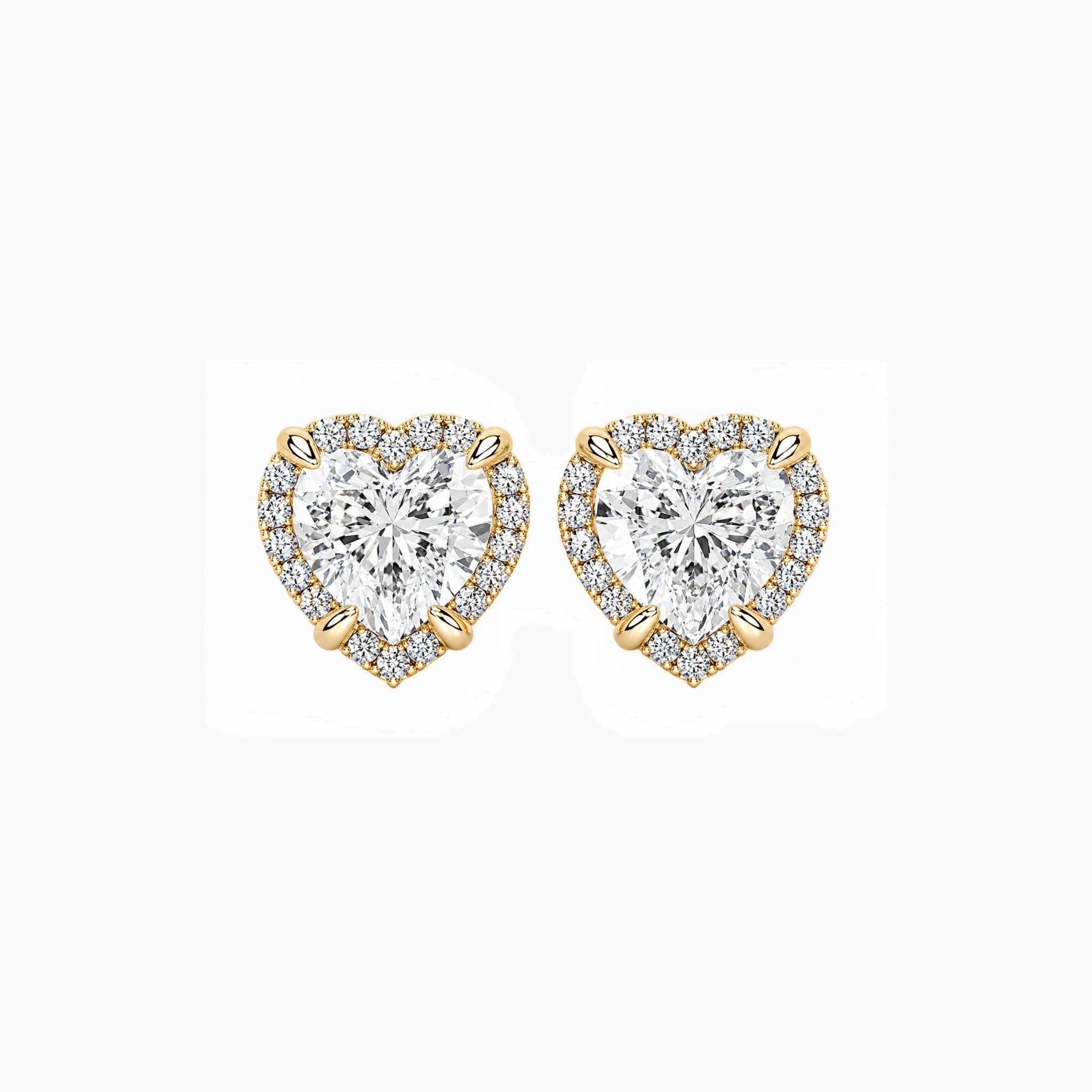 Heart-cut moissanite halo stud earrings in yellow gold vermeil, front view.