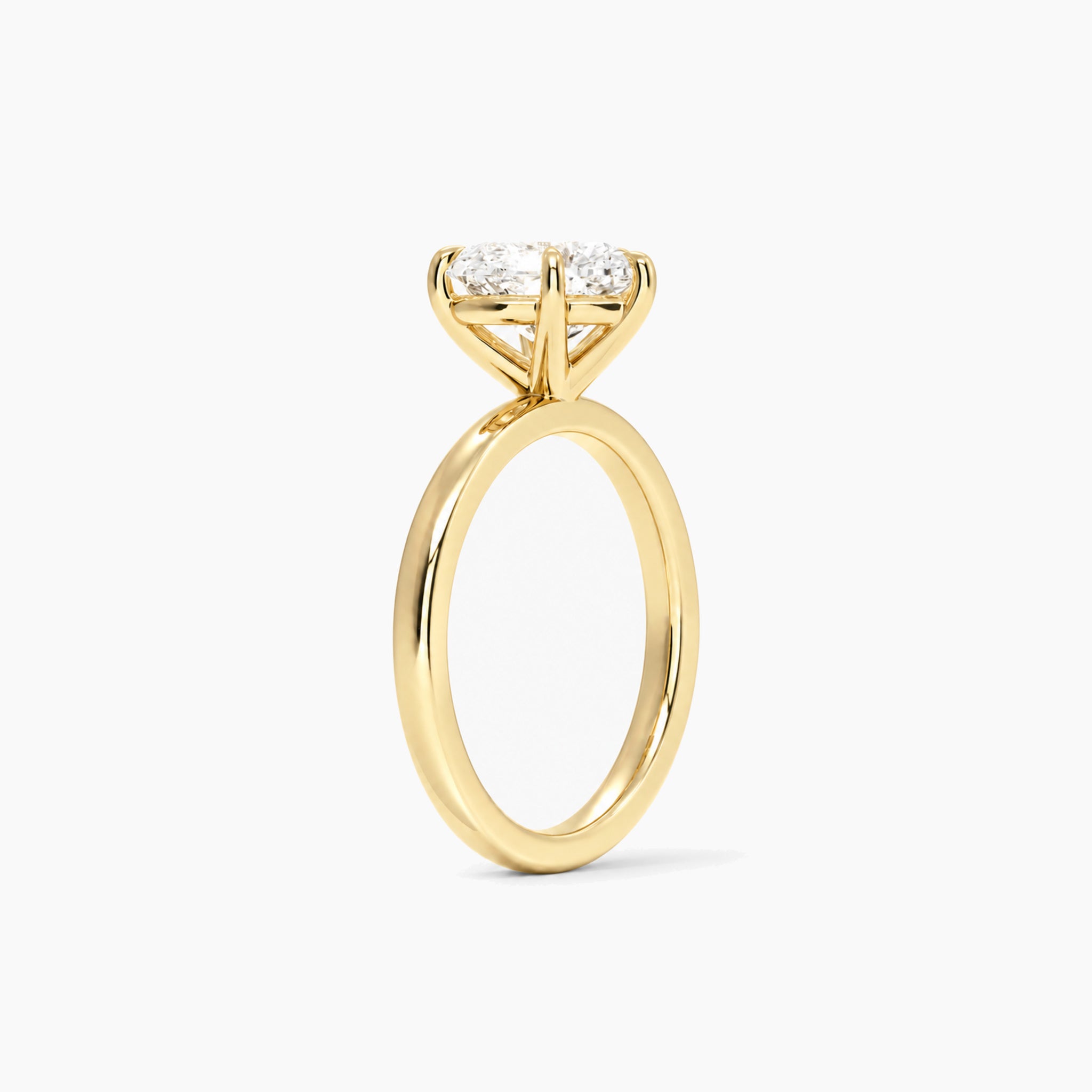 Heart-Cut Moissanite Solitaire Ring in yellow gold, side view