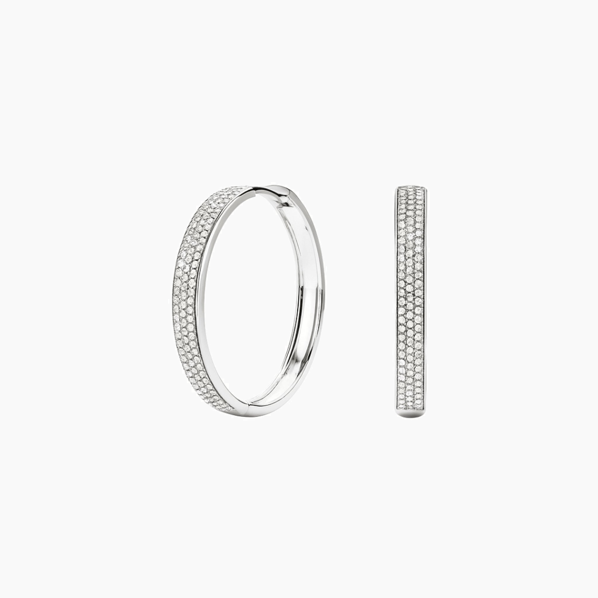Large bold pavé moissanite hoop earrings in white gold vermeil, front and side views.