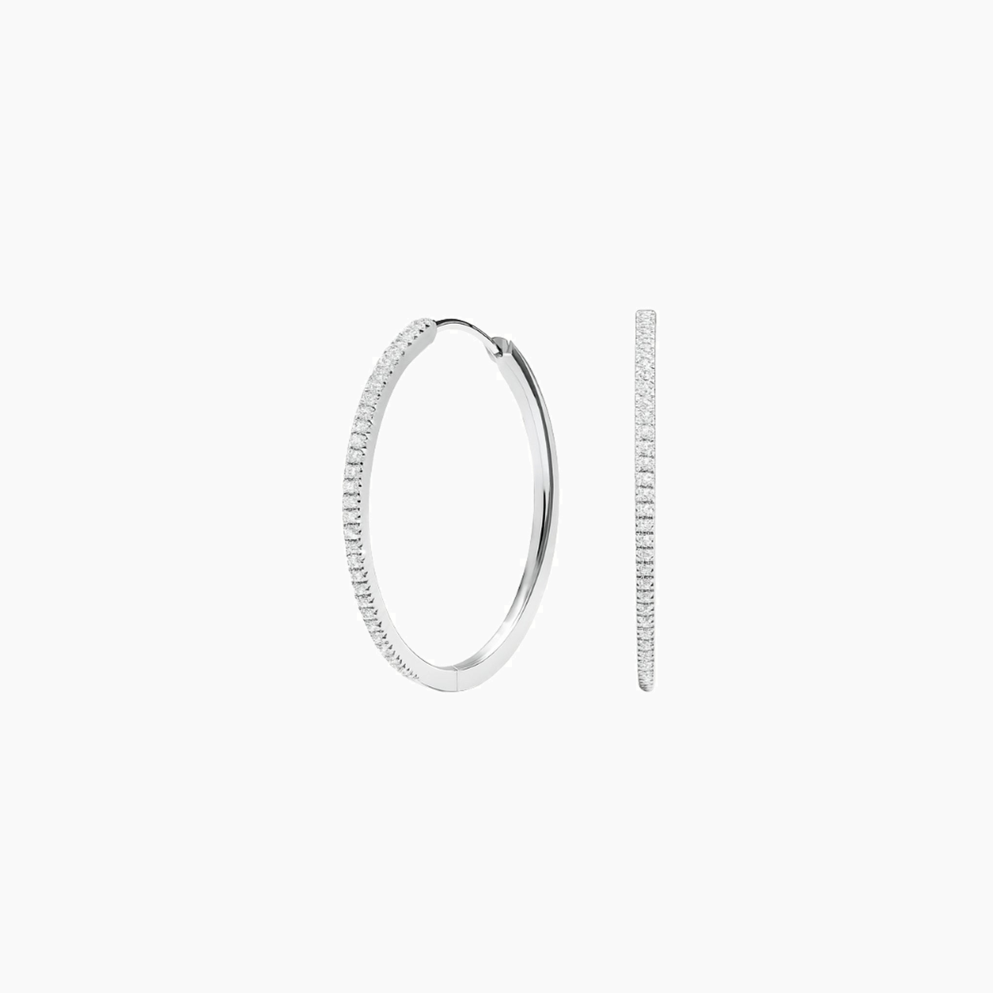 Large pavé moissanite hoop earrings in white gold vermeil, front and side views.