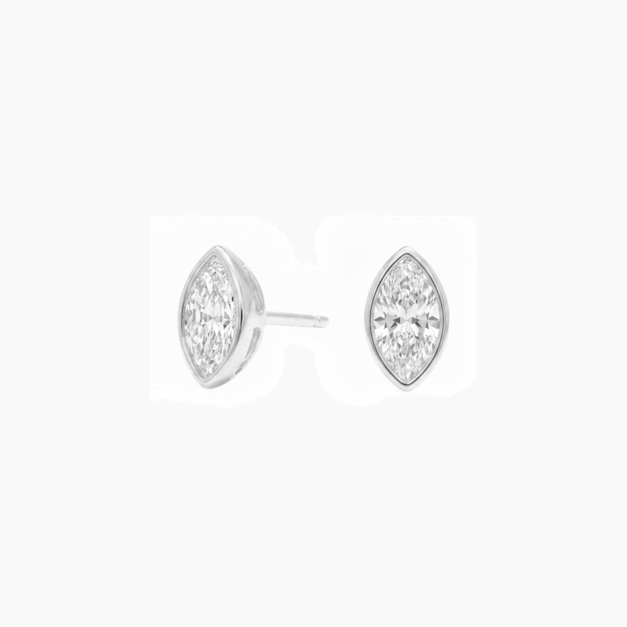 Marquise-cut moissanite bezel stud earrings in white gold vermeil, front and side views.