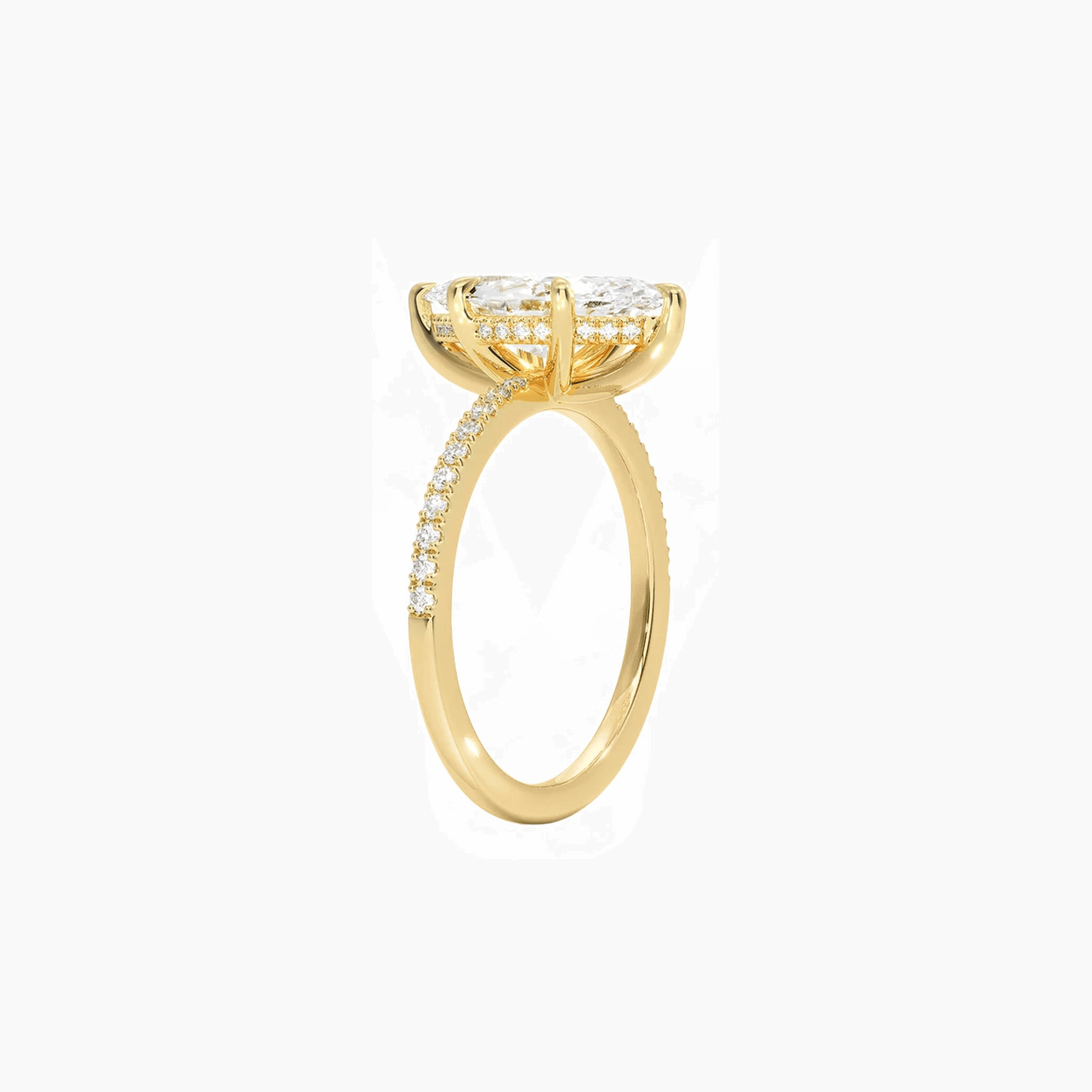 Marquise-cut moissanite hidden halo ring with pavé band in yellow gold vermeil, side view.