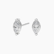 Marquise-cut moissanite stud earrings in white gold vermeil, front and side views.