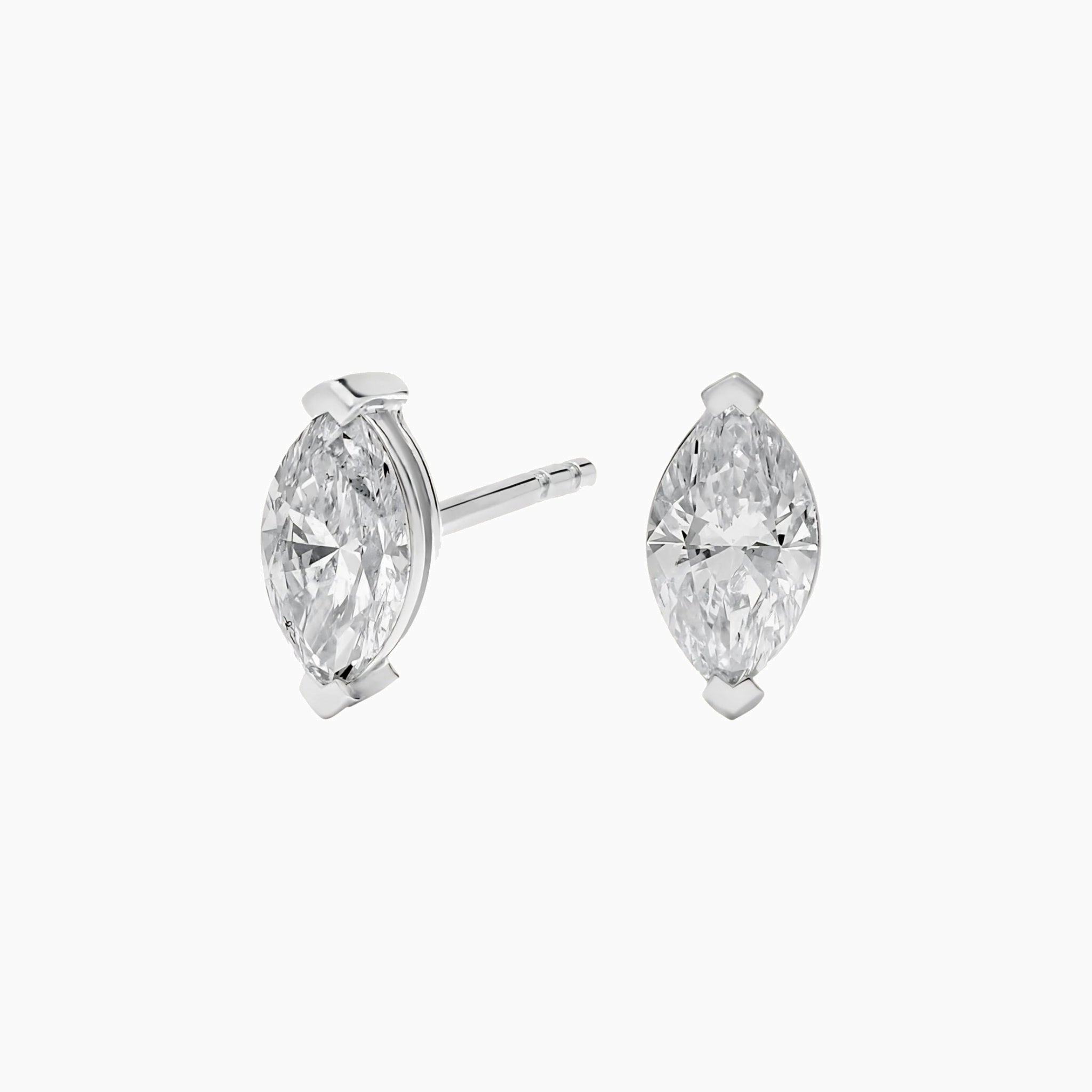 Marquise-cut moissanite stud earrings in white gold vermeil, front and side views.