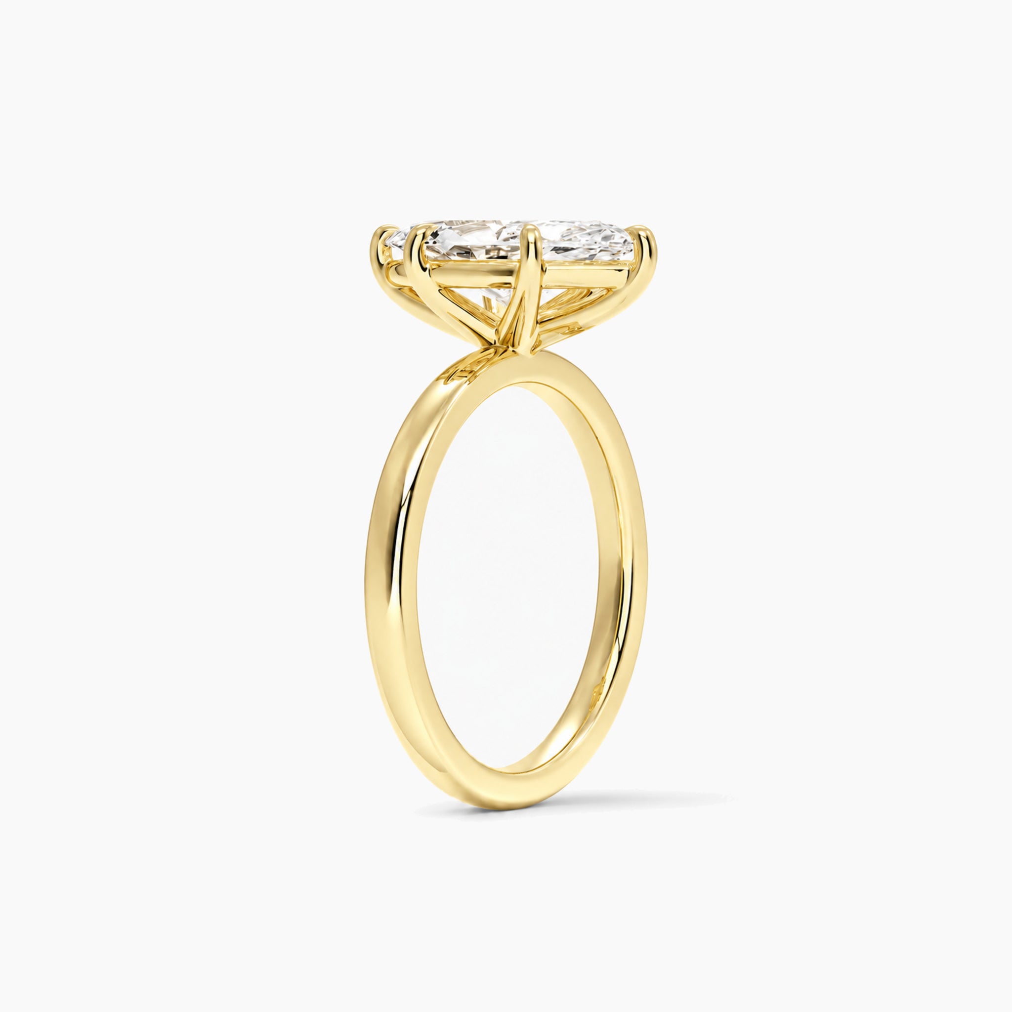 marquise-cut moissanite solitaire ring in yellow gold, 2 carat side view