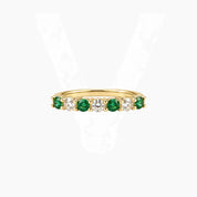 Moissanite and lab-grown emerald half eternity ring in yellow gold vermeil, front view.