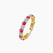 Moissanite and lab-grown ruby eternity ring in yellow gold vermeil, front view.