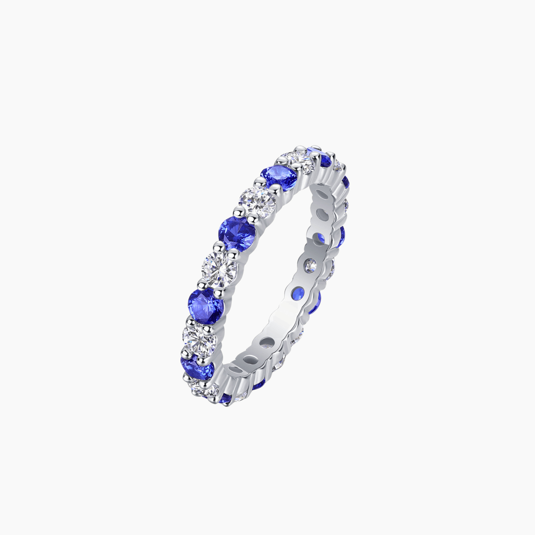 Moissanite and lab-grown sapphire eternity ring in white gold vermeil, front view.