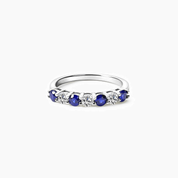 Moissanite and lab-grown sapphire half eternity ring in white gold vermeil, front view.