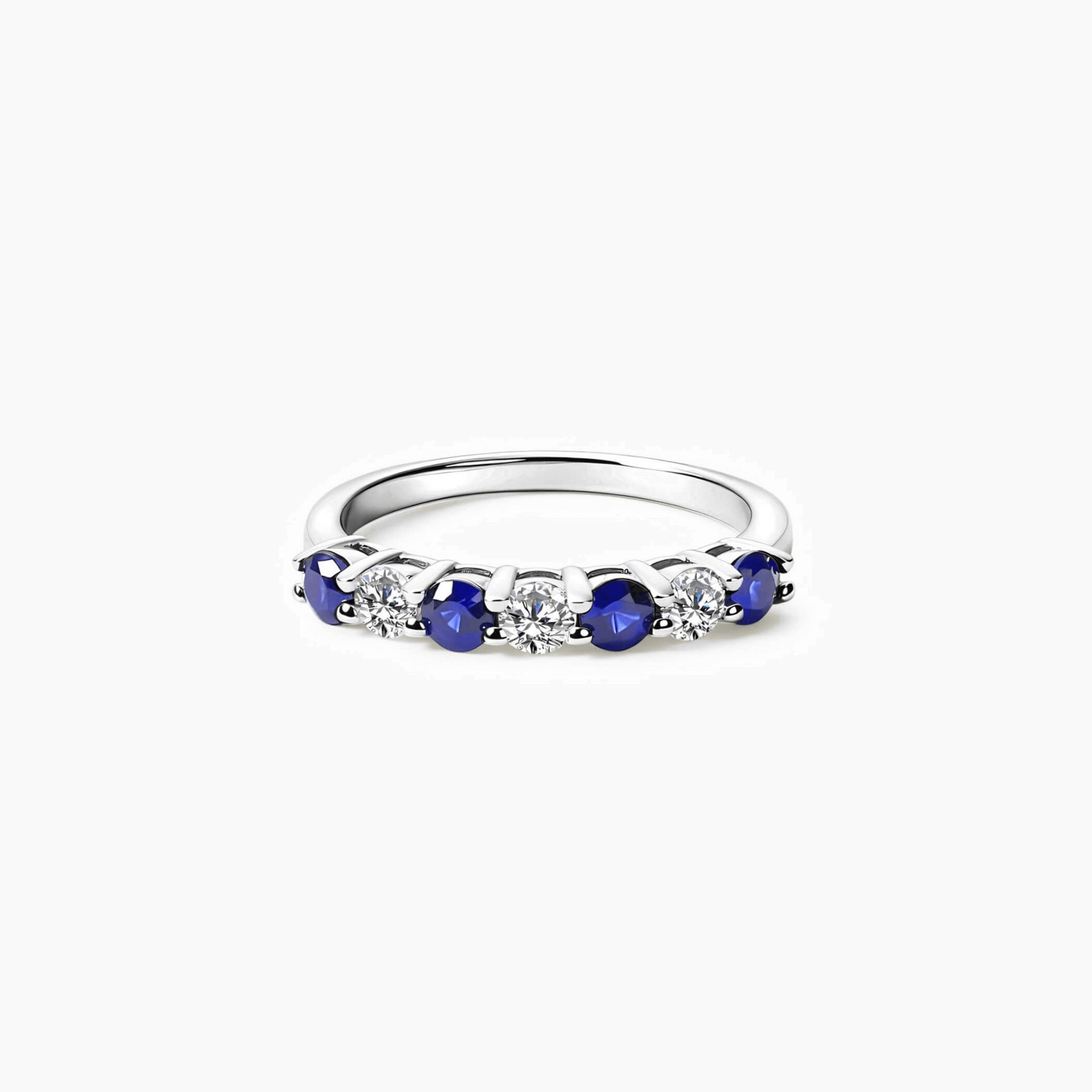 Moissanite and lab-grown sapphire half eternity ring in white gold vermeil, front view.