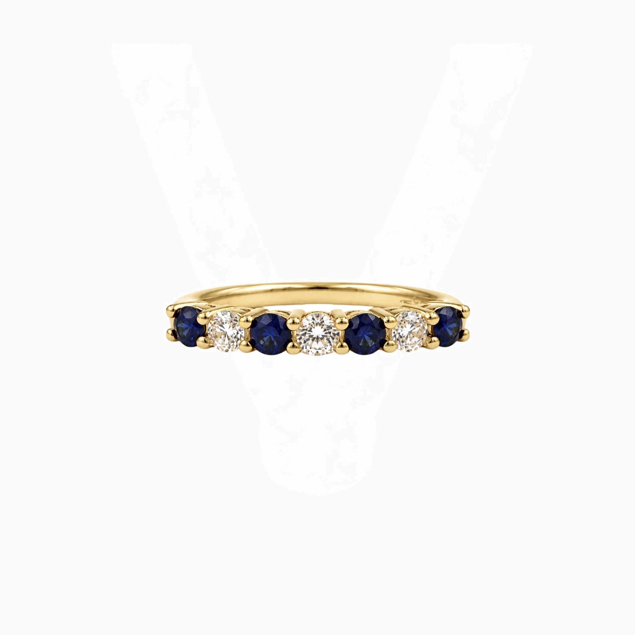 Moissanite and lab-grown sapphire half eternity ring in yellow gold vermeil, front view.