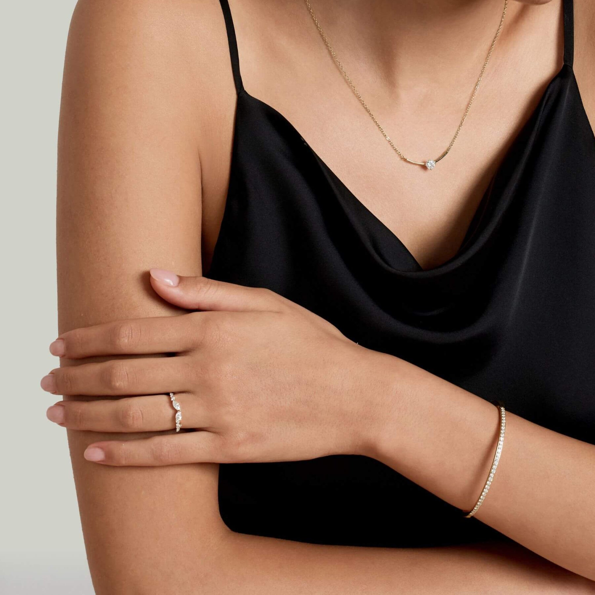 Moissanite bangle bracelet worn on the wrist.