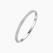 Moissanite bangle bracelet in white gold vermeil, angled view.