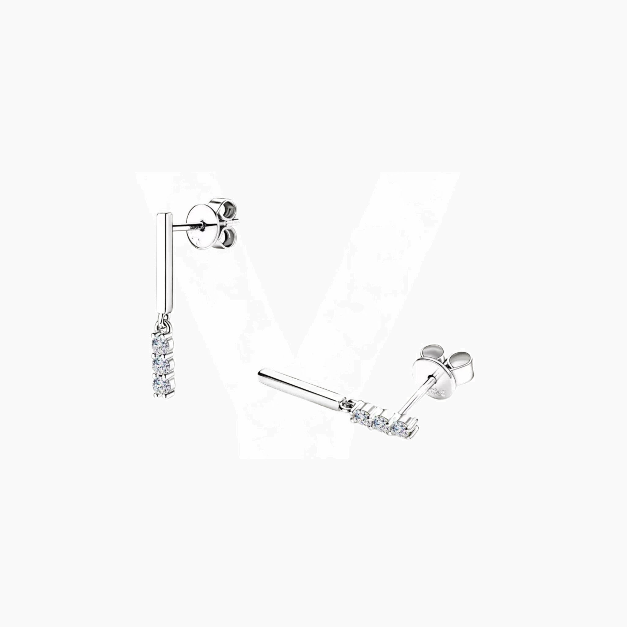 Moissanite bar drop earrings in white gold vermeil, angled view.