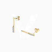Moissanite bar drop earrings in yellow gold vermeil, angled view.