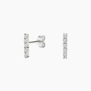 Moissanite bar stud earrings in white gold vermeil, front and side views.