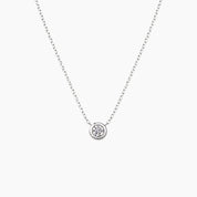 Moissanite bezel pendant necklace in white gold vermeil, front view.