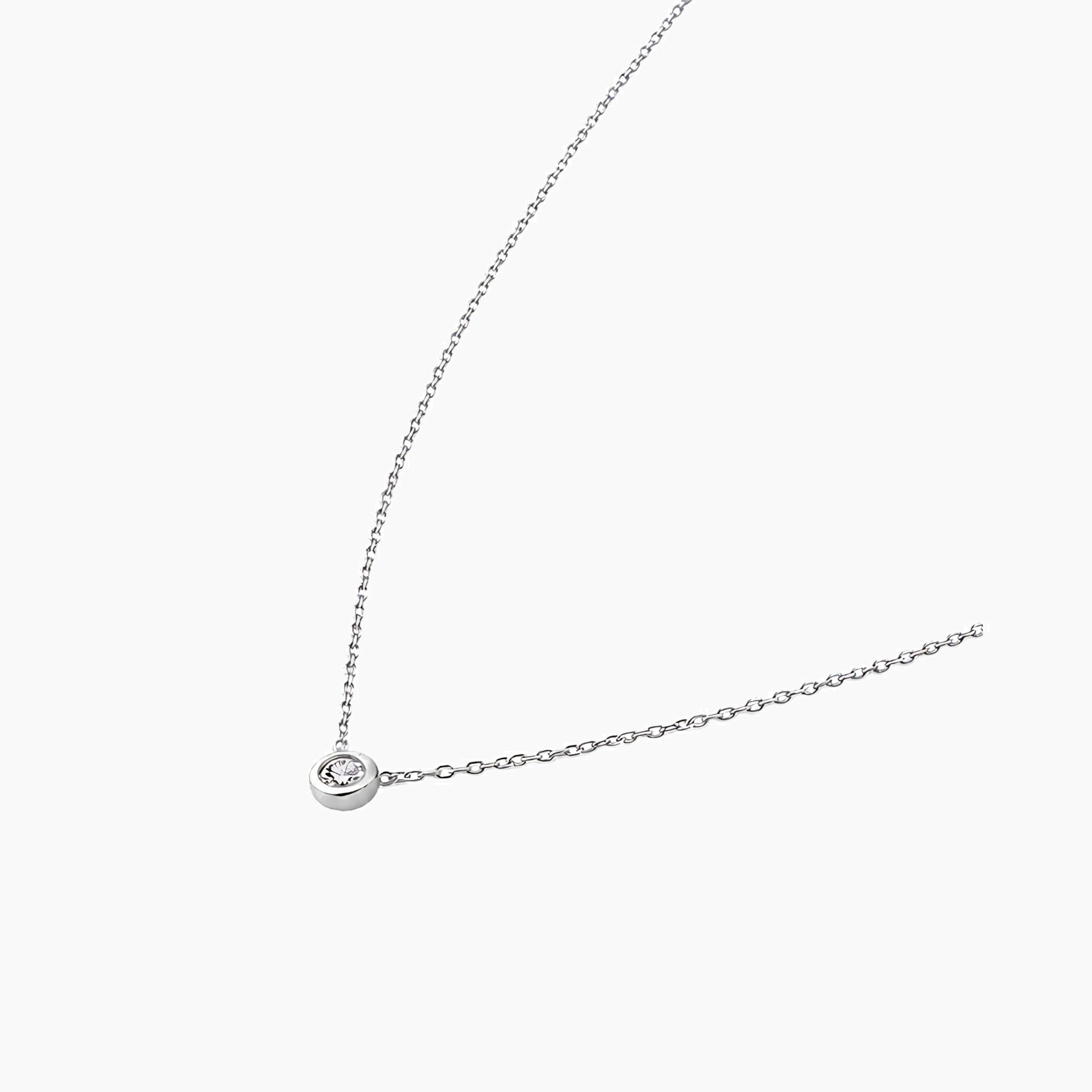 Moissanite bezel pendant necklace in white gold vermeil, side view.