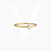 Moissanite bezel solitaire ring in yellow gold vermeil, front view.