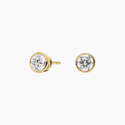 Moissanite bezel stud earrings in yellow gold vermeil, front and side views.