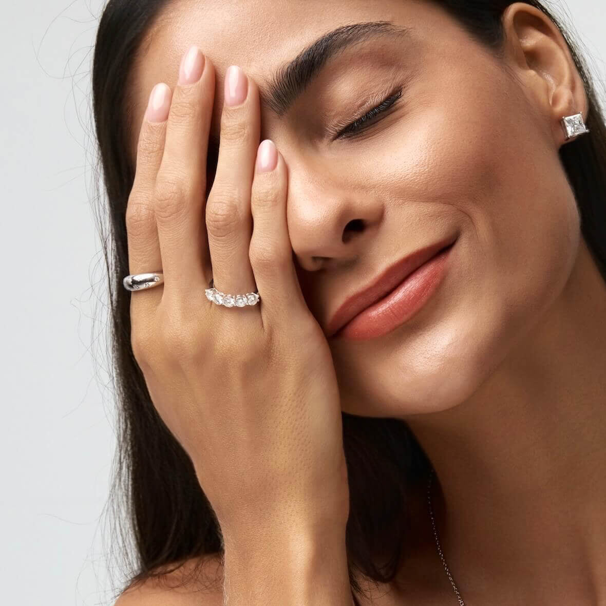 Moissanite celestial dome ring worn on a finger.
