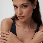 Moissanite cluster bar necklace worn at the neckline.