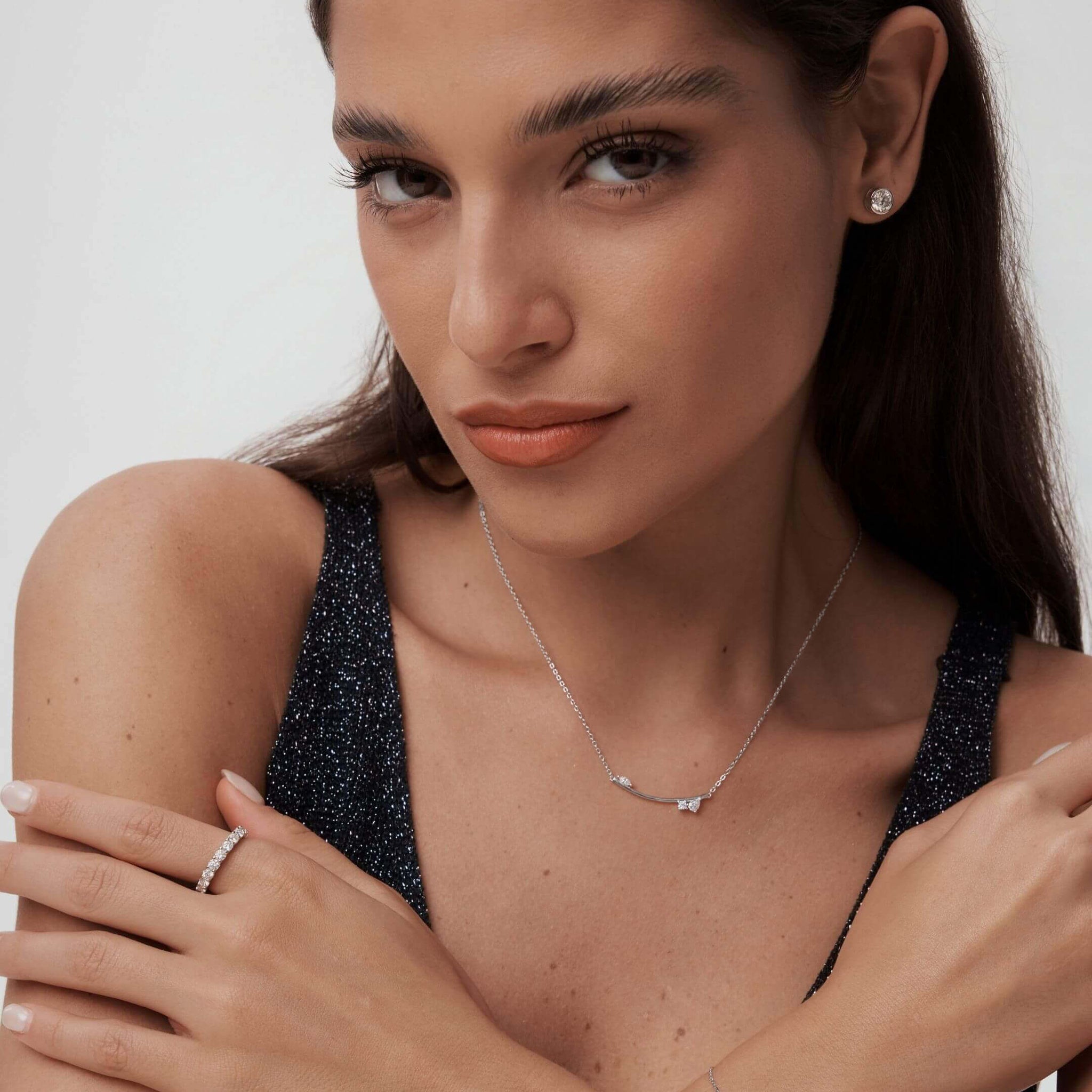 Moissanite cluster bar necklace worn at the neckline.