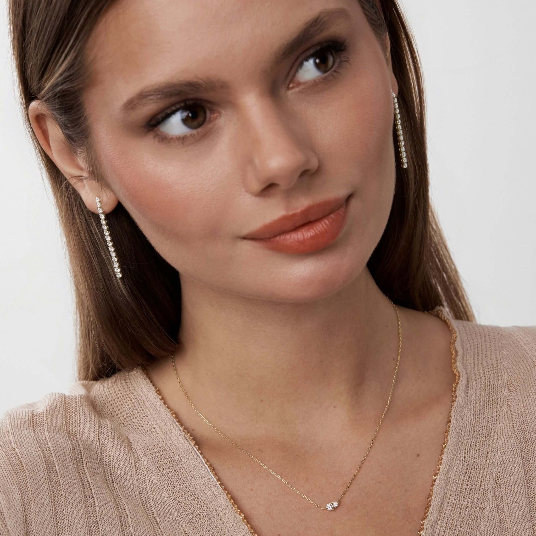 Moissanite duo necklace worn at the neckline.