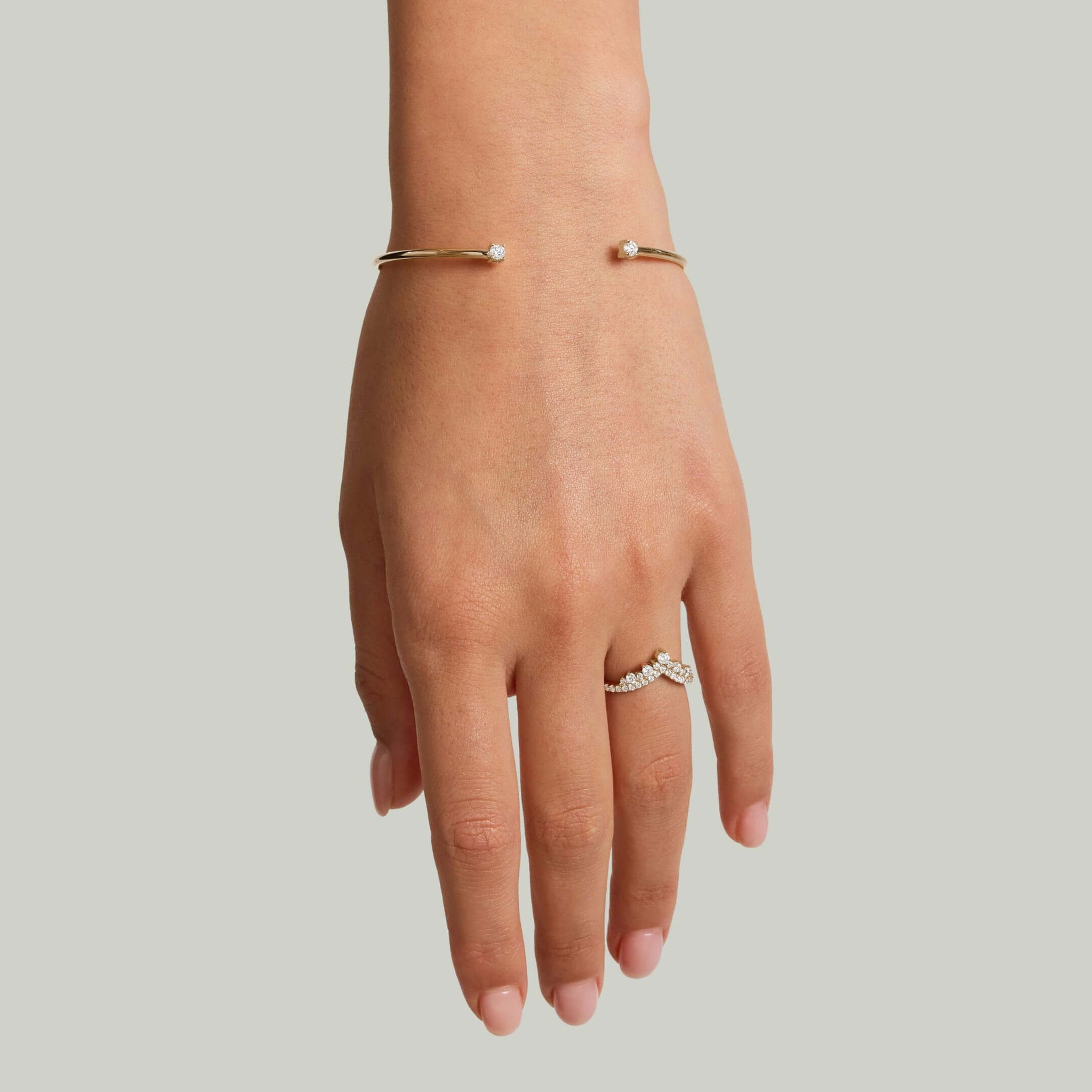 Moissanite flexible cuff bracelet worn on the wrist.