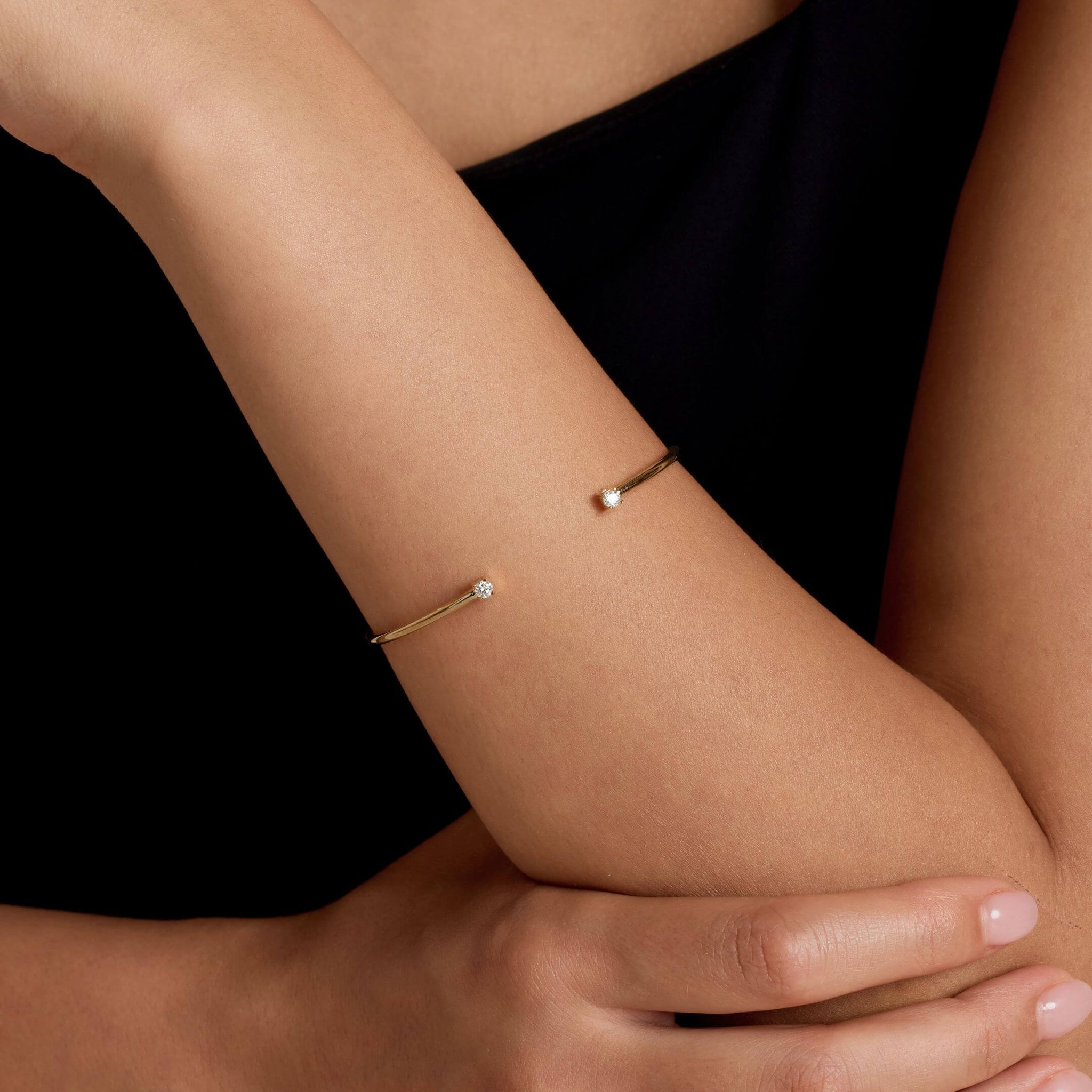Moissanite flexible cuff bracelet worn on the wrist.