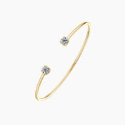 Moissanite flexible cuff bracelet in yellow gold vermeil, angled view.