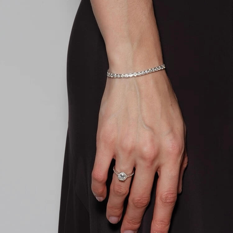Moissanite half tennis bolo bracelet worn on the wrist.