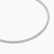 Moissanite half tennis bolo bracelet in white gold vermeil, close-up detail.