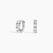 Moissanite huggie hoop earrings in white gold vermeil, front and side views.