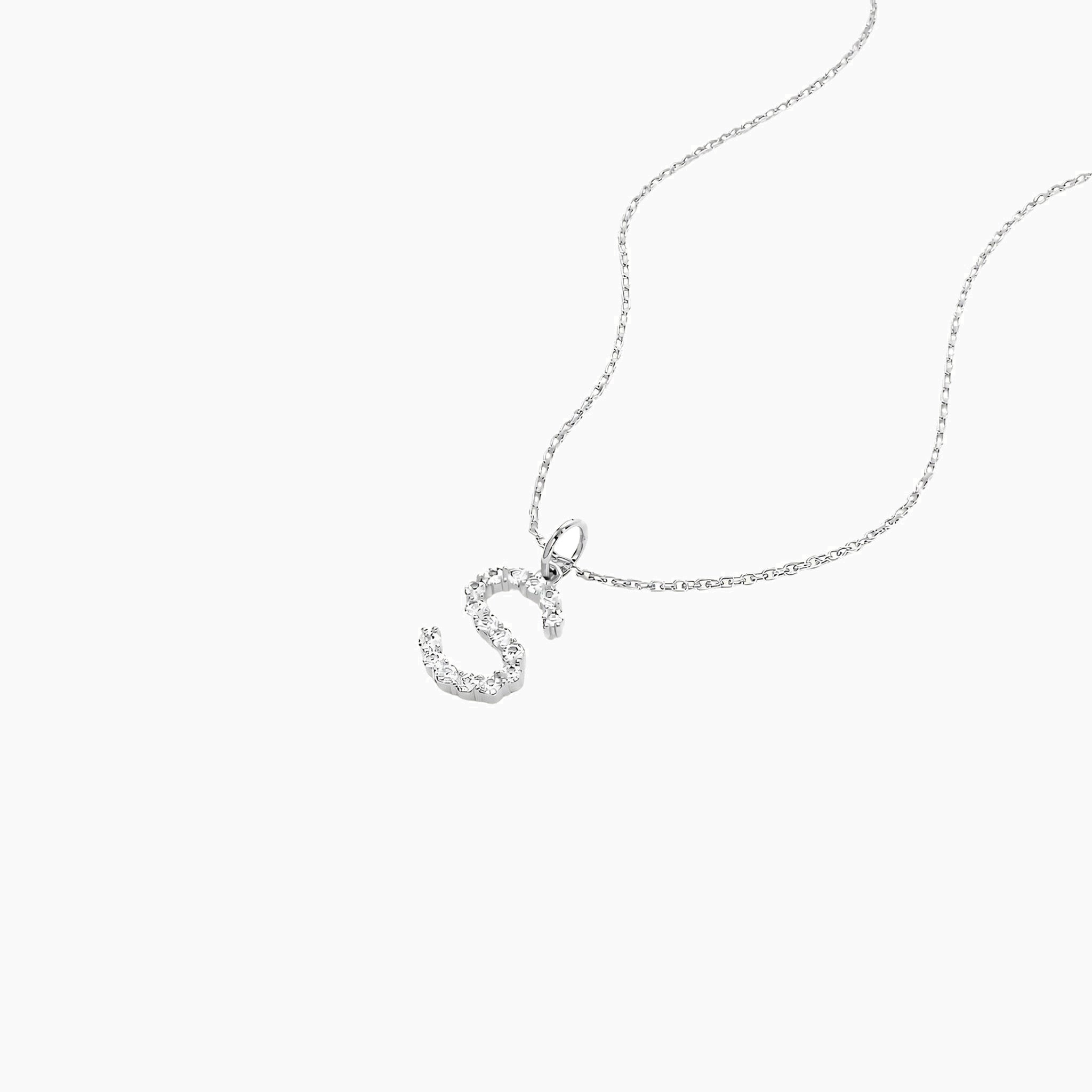 Moissanite initial necklace in white gold vermeil, close-up detail.