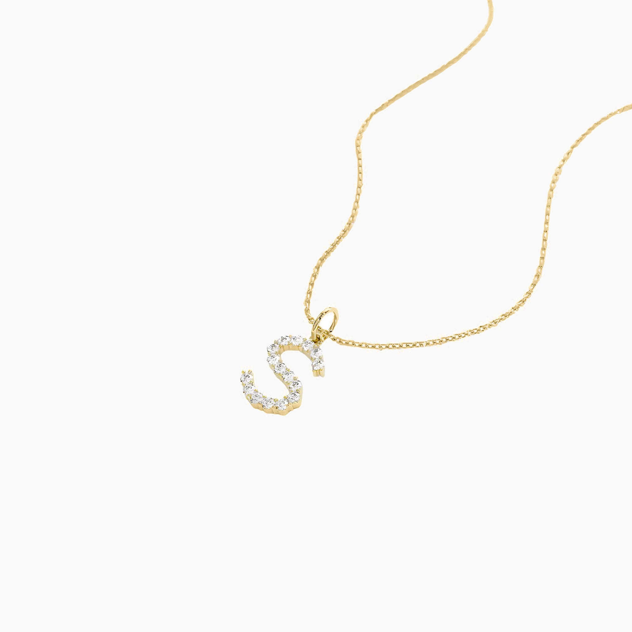 Moissanite initial necklace in yellow gold vermeil, close-up detail.