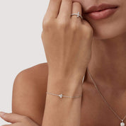 Moissanite lotus bracelet worn on the wrist.
