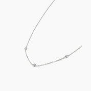 Moissanite satellite necklace in white gold vermeil, side view.