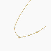 Moissanite satellite necklace in yellow gold vermeil, side view.