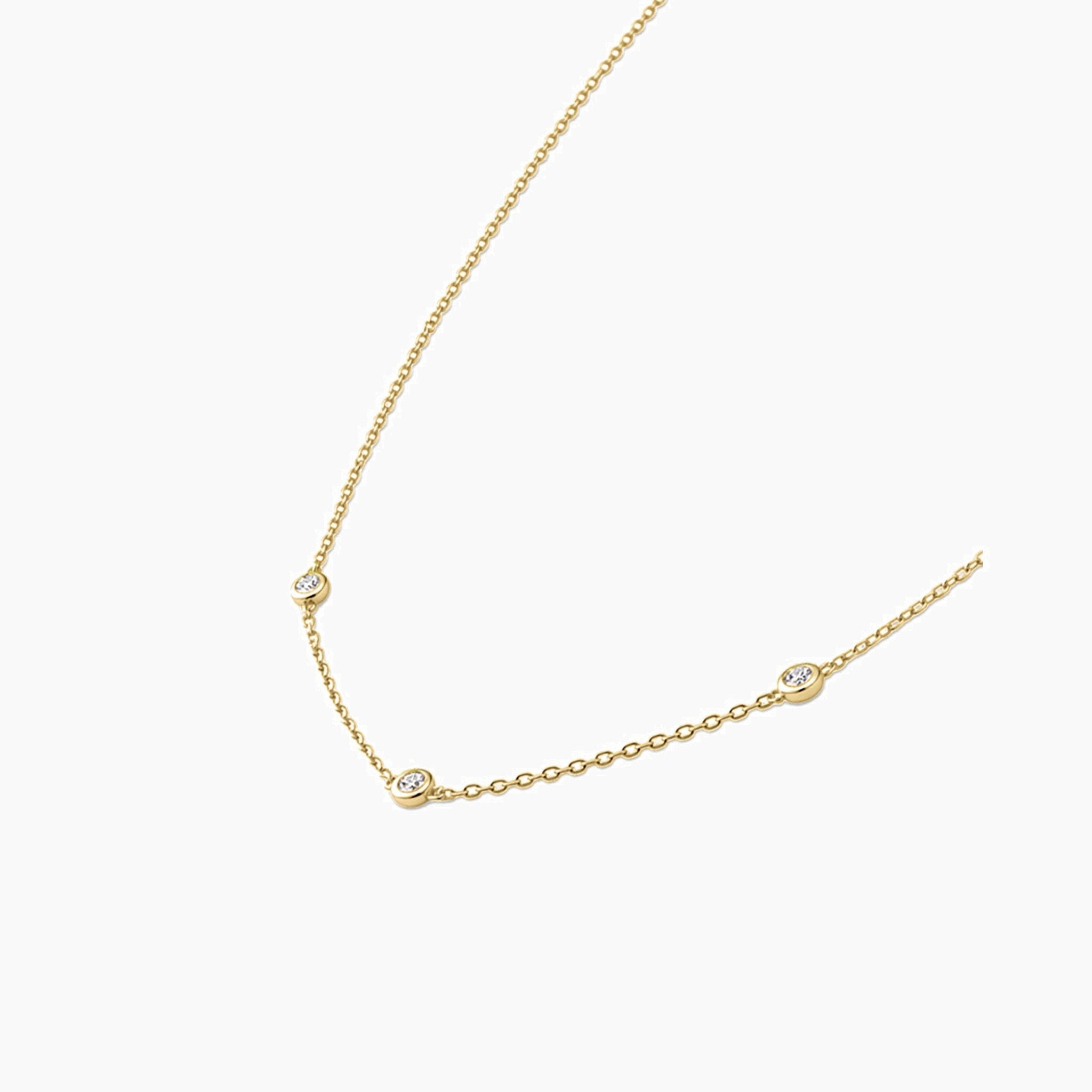 Moissanite satellite necklace in yellow gold vermeil, side view.