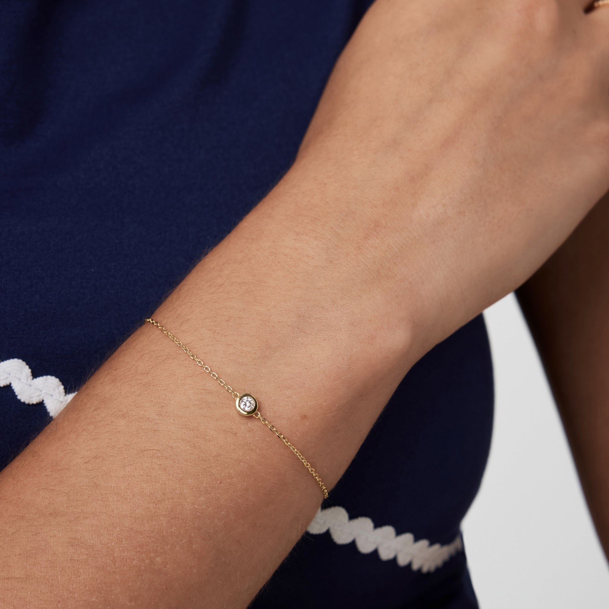 Moissanite solitaire bracelet worn on the wrist.
