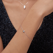 Moissanite solitaire bracelet worn on the wrist.