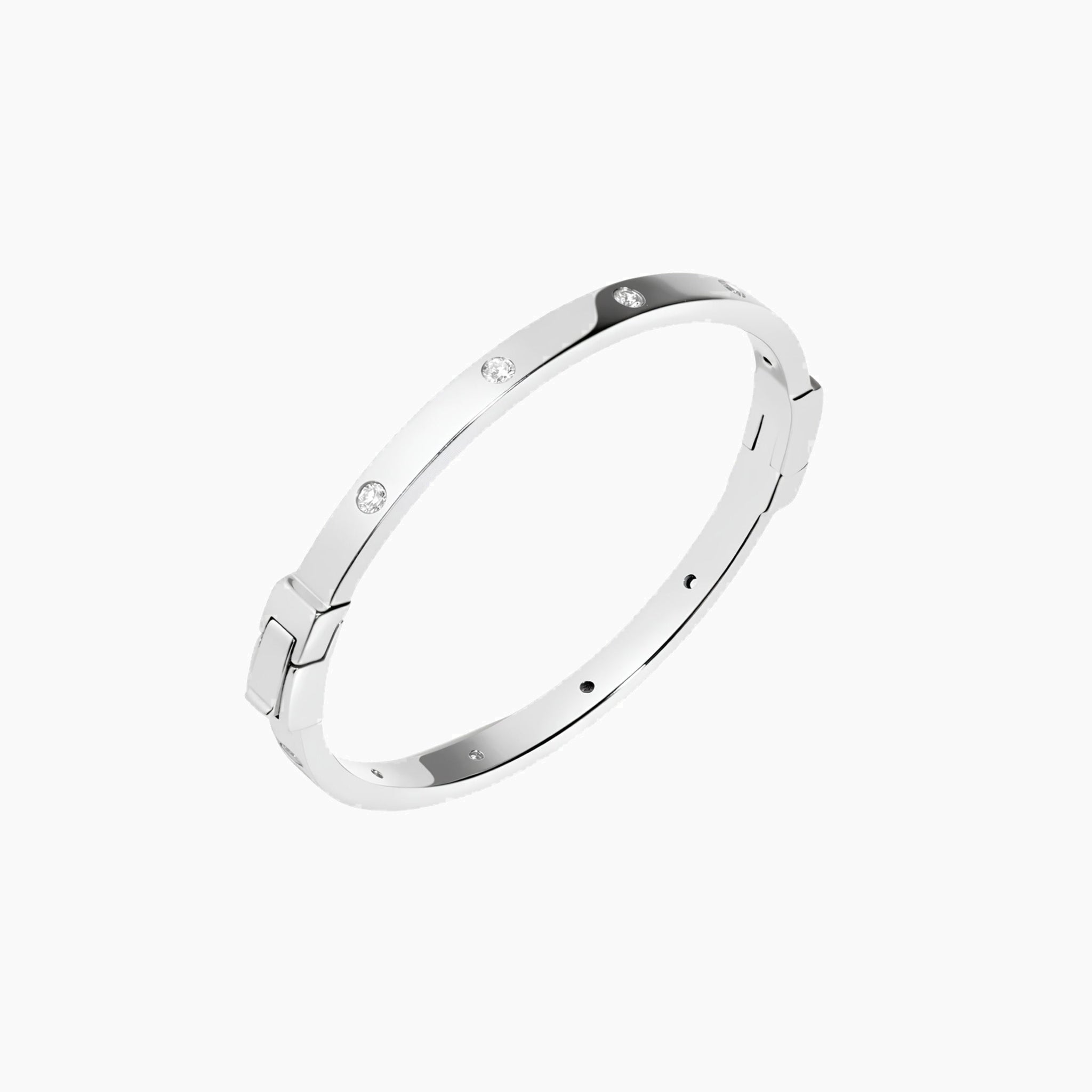 Moissanite station bangle bracelet in white gold vermeil, angled view.