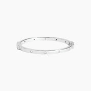 Moissanite station bangle bracelet in white gold vermeil, front view.