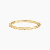 Moissanite station bangle bracelet in yellow gold vermeil, front view.