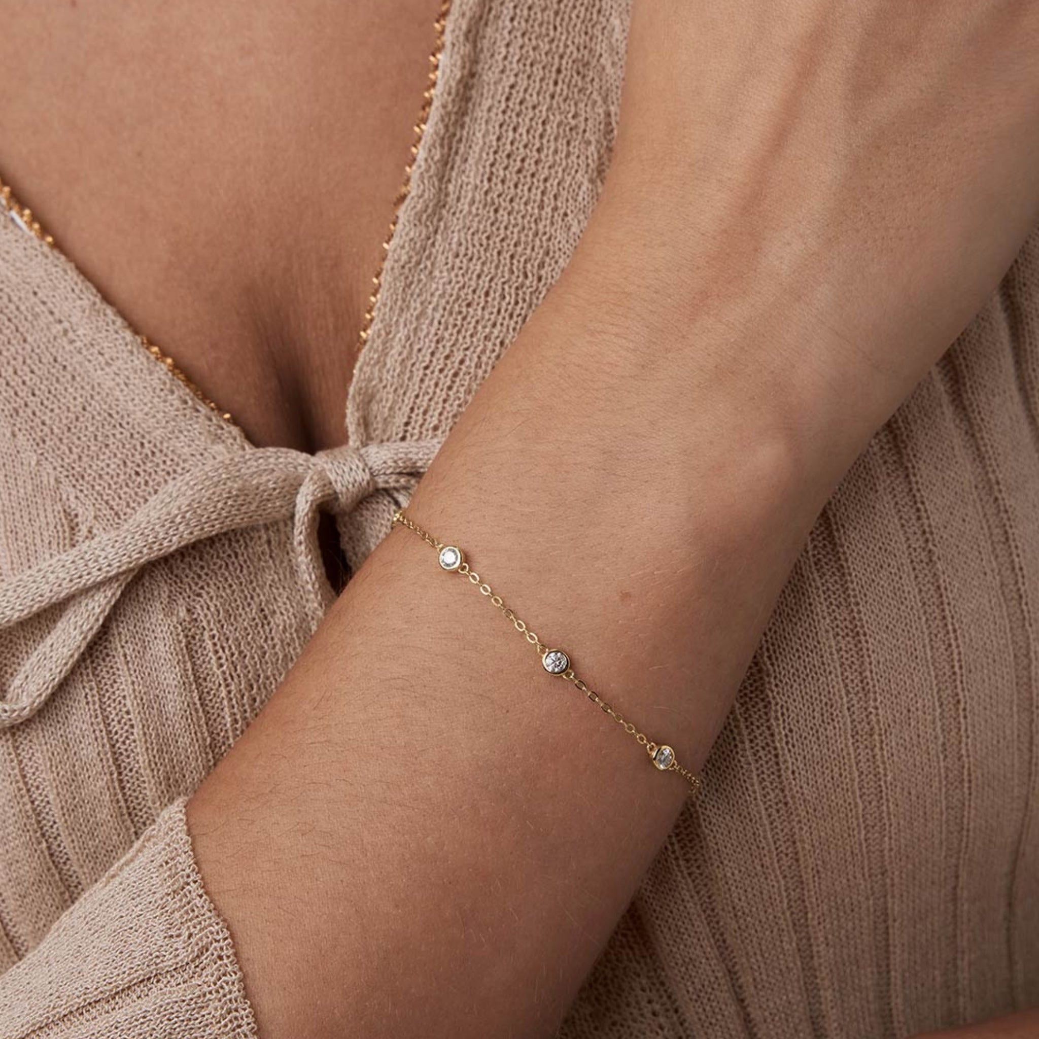 Moissanite station bracelet worn on the wrist.