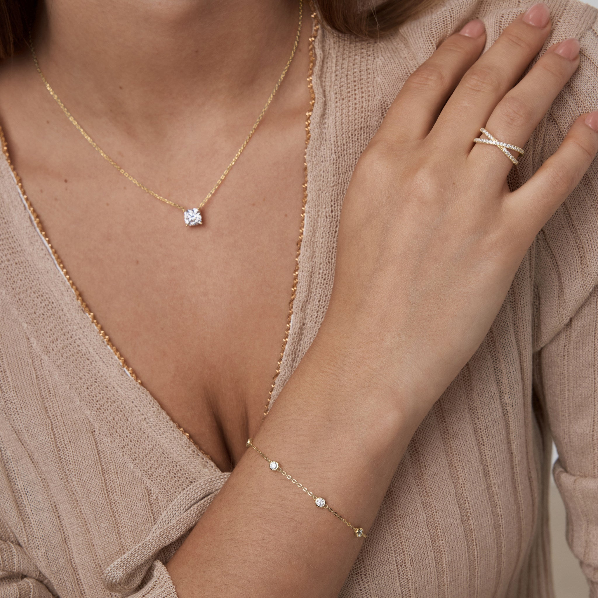 Moissanite station bracelet worn on the wrist.